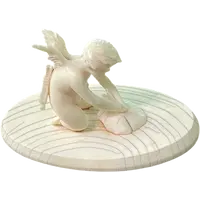 Petite sculpture en ivoire représentant Cupidon en train d'aiguiser
