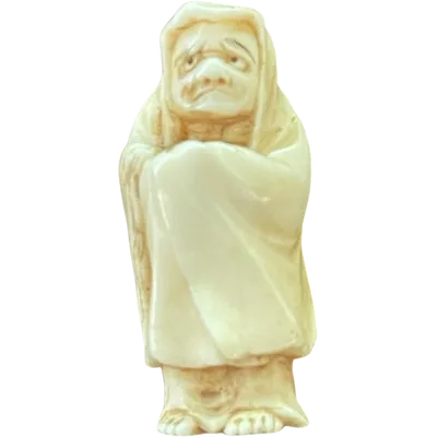 Ivory netsuke depicting a male figure wearing a cloak. Japan.