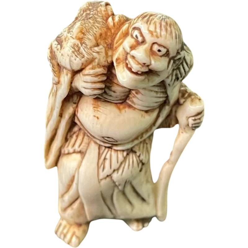 Netsuke in avorio raffigurante personaggio maschile