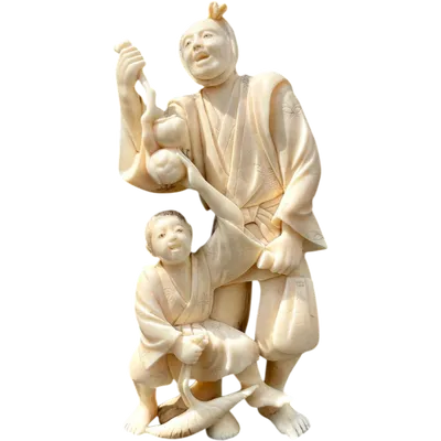 Okimono ivory sculpture depicting a man and a boy.
