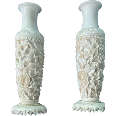 Pair of ivory vases with floral bas-relief decoration. China.