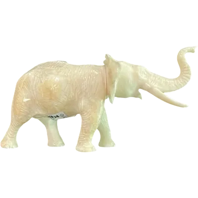 A small ivory sculpture depicting an elephant.
