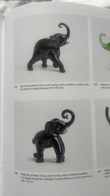 Black glass elephant with milky glass tusks. Made by Toso. Murano. 11x10x5 cm.