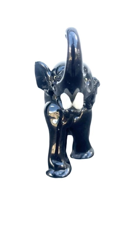 Black glass elephant with milky glass tusks. Made by Toso. Murano. 11x10x5 cm.