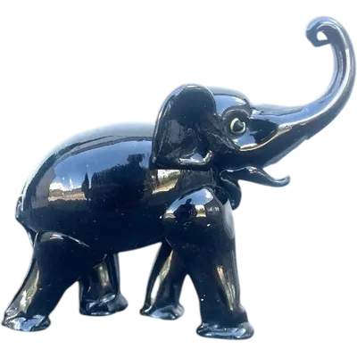 Black glass elephant with milky glass tusks. Made by Toso. Murano. 11x10x5 cm.