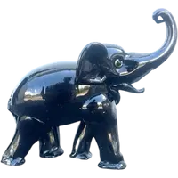 Black glass elephant with milky glass tusks. Made by Toso. Murano. 11x10x5 cm.