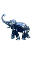 Black glass elephant with milky glass tusks. Made by Toso. Murano. 11x10x5 cm.