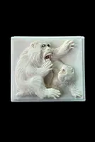 A small ivory box with a lid engraved with two monkeys in high relief.