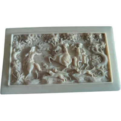 Antique, finely carved ivory plaque depicting a hunting scene