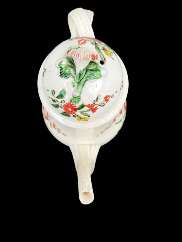 Earthenware coffee pot decorated with roses. Derbyshire, England.