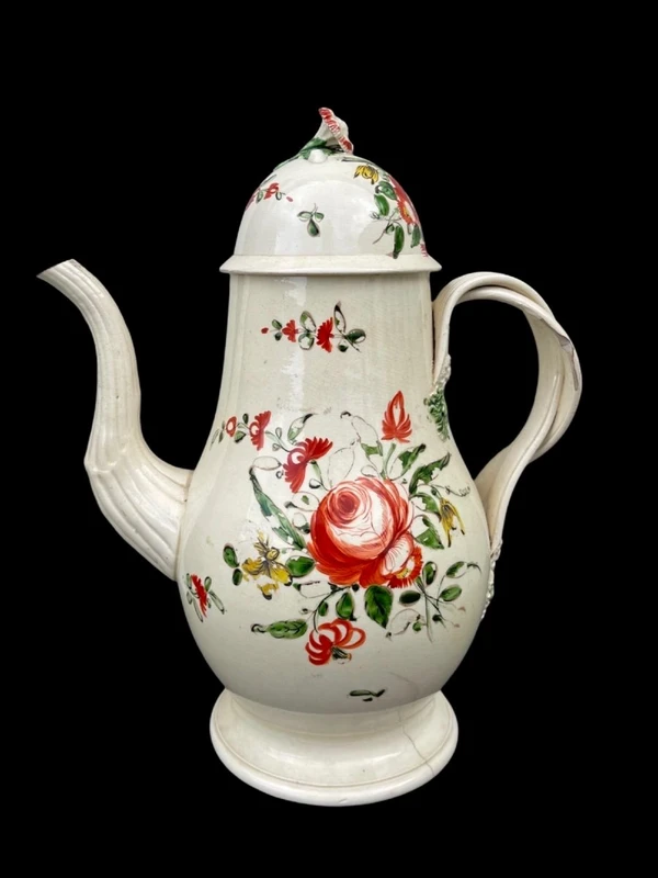 Earthenware coffee pot decorated with roses. Derbyshire, England.