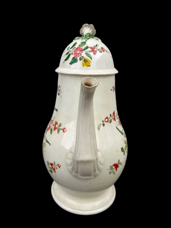 Earthenware coffee pot decorated with roses. Derbyshire, England.