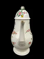 Earthenware coffee pot decorated with roses. Derbyshire, England.