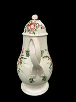 Earthenware coffee pot decorated with roses. Derbyshire, England.