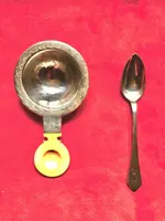 Set of six silver teaspoons with a silver tea strainer engraved with initials