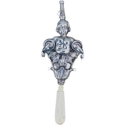 Silver children's rattle featuring a figure of a boy. Europe.