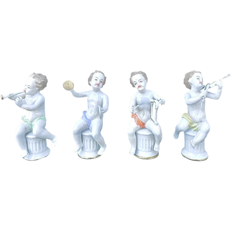 A series of four porcelain musicians seated on columns.