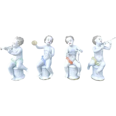 A series of four porcelain musicians seated on columns.