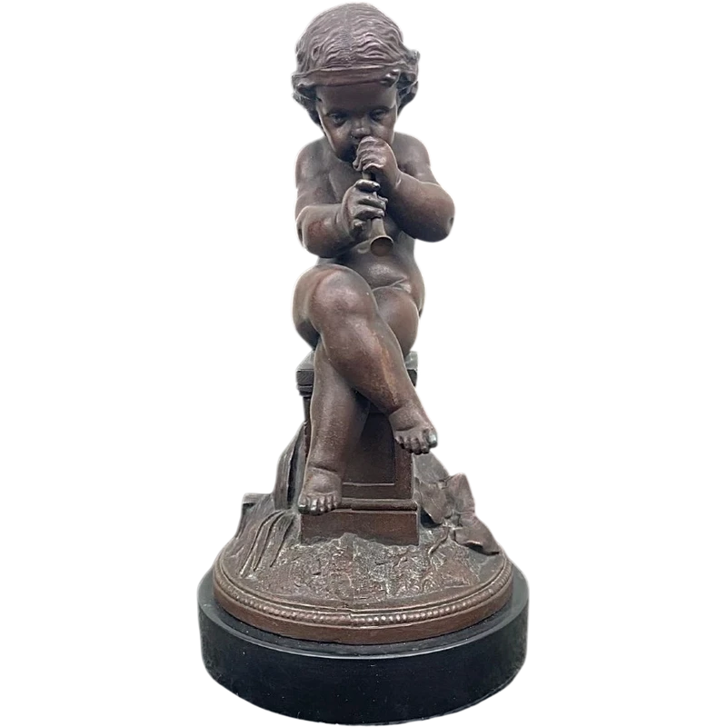 A small bronze sculpture depicting a cherub playing the flute.