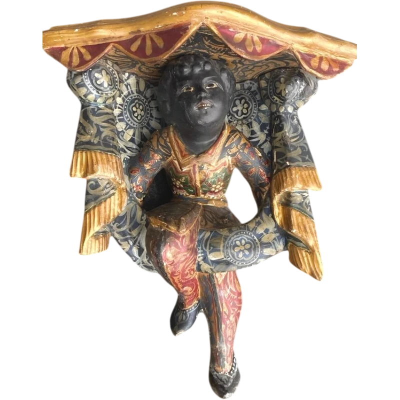 Carved and painted wooden corner shelf with an engraved top and gold-leaf details