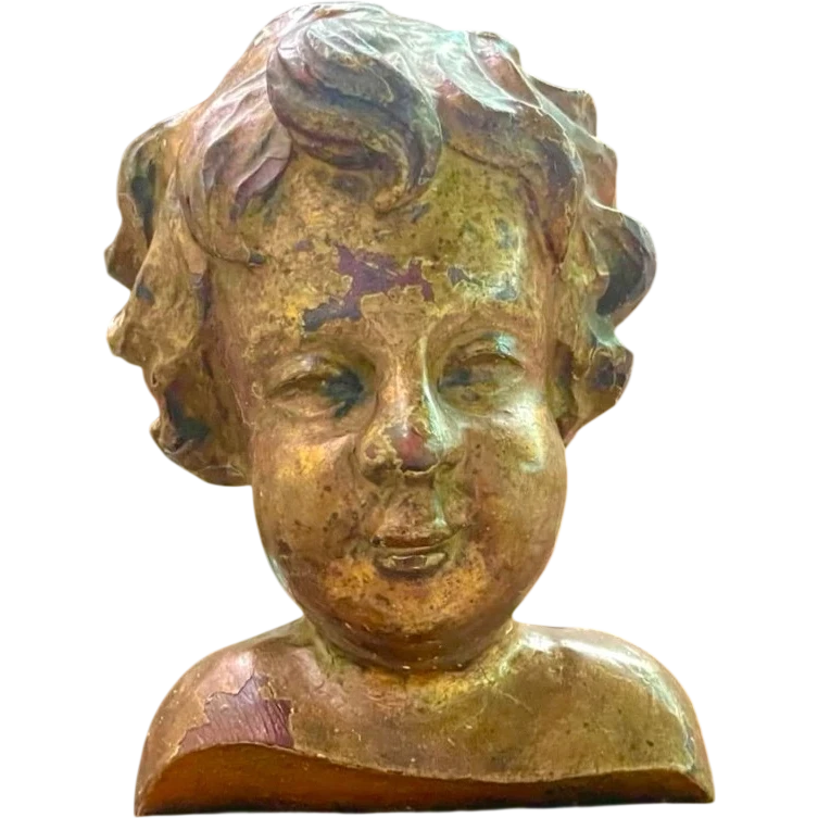 Busto di bambino in legno intagliato e dorato a mecca,montato su base lignea.