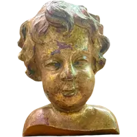 Busto di bambino in legno intagliato e dorato a mecca,montato su base lignea.