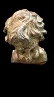 Busto di bambino in legno intagliato e dorato a mecca,montato su base lignea.
