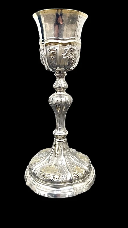Embossed silver chalice with a tapered globular body decorated with grape cluster motifs