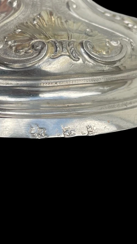Embossed silver chalice with a tapered globular body decorated with grape cluster motifs