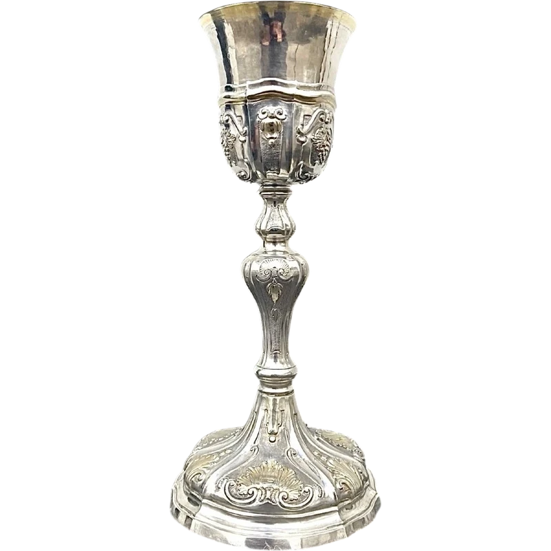 Embossed silver chalice with a tapered globular body decorated with grape cluster motifs