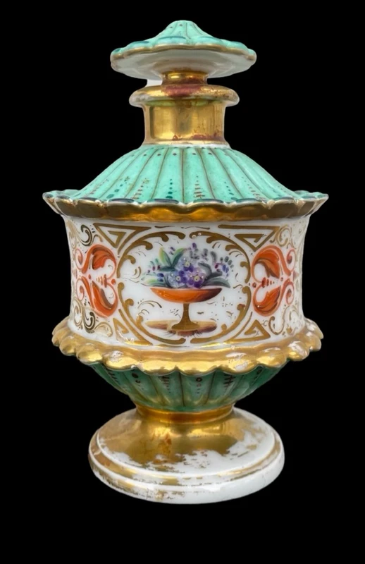 Oriental-inspired polychrome porcelain perfume bottle with a floral basket design