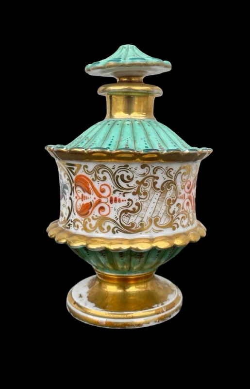 Oriental-inspired polychrome porcelain perfume bottle with a floral basket design