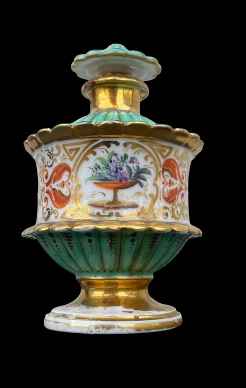 Oriental-inspired polychrome porcelain perfume bottle with a floral basket design