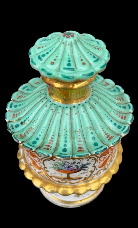 Oriental-inspired polychrome porcelain perfume bottle with a floral basket design
