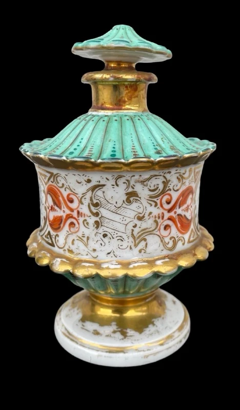 Oriental-inspired polychrome porcelain perfume bottle with a floral basket design