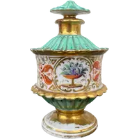 Oriental-inspired polychrome porcelain perfume bottle with a floral basket design