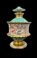 Oriental-inspired polychrome porcelain perfume bottle with a floral basket design
