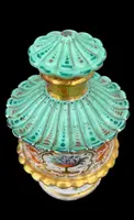 Oriental-inspired polychrome porcelain perfume bottle with a floral basket design
