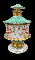 Oriental-inspired polychrome porcelain perfume bottle with a floral basket design