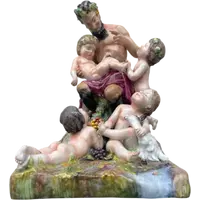 Ensemble en porcelaine polychrome représentant un faune et des putti dans un décor champêtre. Manufacture Ginori.