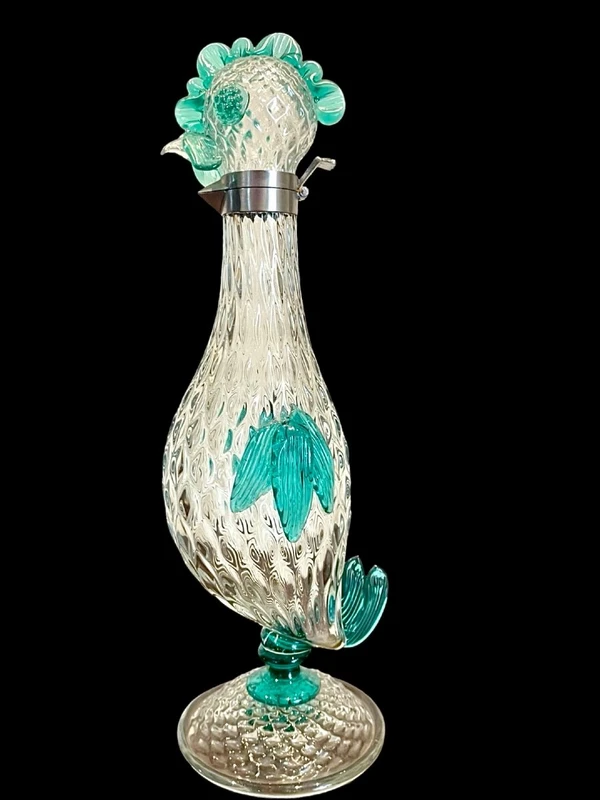 A slightly iridescent aquamarine "balloton" glass bottle. Flavio Poli for Seguso
