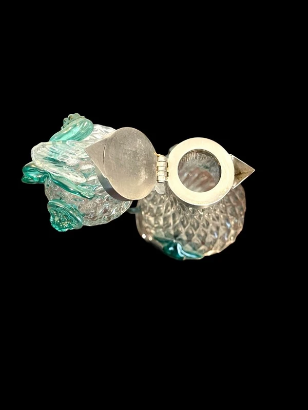 A slightly iridescent aquamarine "balloton" glass bottle. Flavio Poli for Seguso