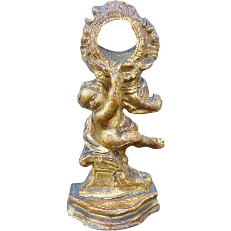 Carved wooden clock stand with gold leaf, depicting a boy