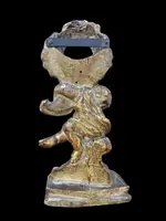 Carved wooden clock stand with gold leaf, depicting a boy