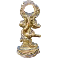 Carved wooden clock stand with gold leaf, depicting a boy