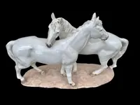 Ceramic sculpture with a base depicting a pair of horses. Made by Mollica.