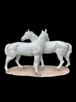 Ceramic sculpture with a base depicting a pair of horses. Made by Mollica.