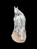 Ceramic sculpture with a base depicting a pair of horses. Made by Mollica.