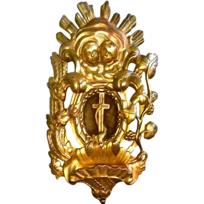 Wooden holy water font with gold leaf, featuring rocaille motifs, cherubs, ears of wheat, and grapevines.
