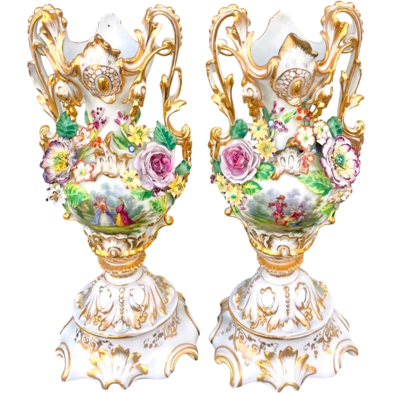 Pair of porcelain vases with two handles, featuring flowers in relief and plant motifs